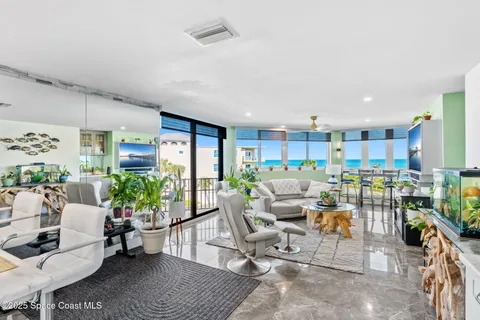 a living room with lots of furniture and a table