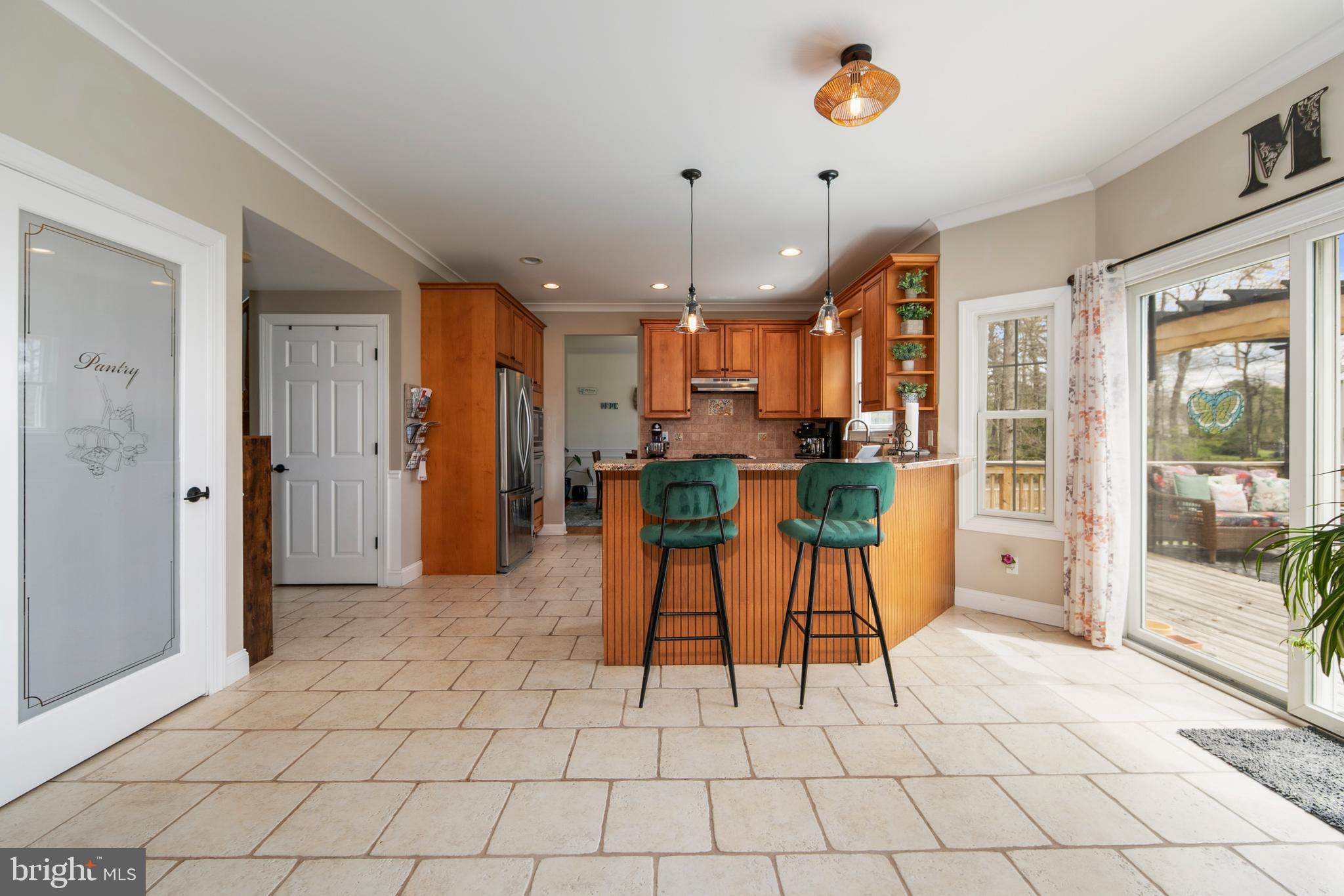 173 West Pleasant Grove Road Jackson, NJ 08527 - Photo 16 of 47 a dining room filled with stainless steel appliances kitchen island granite countertop a refrigerator and a stove top oven