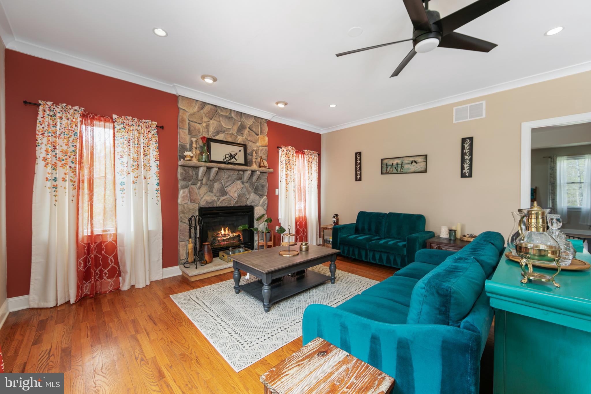 173 West Pleasant Grove Road Jackson, NJ 08527 - Photo 18 of 47 a living room with furniture and a fireplace