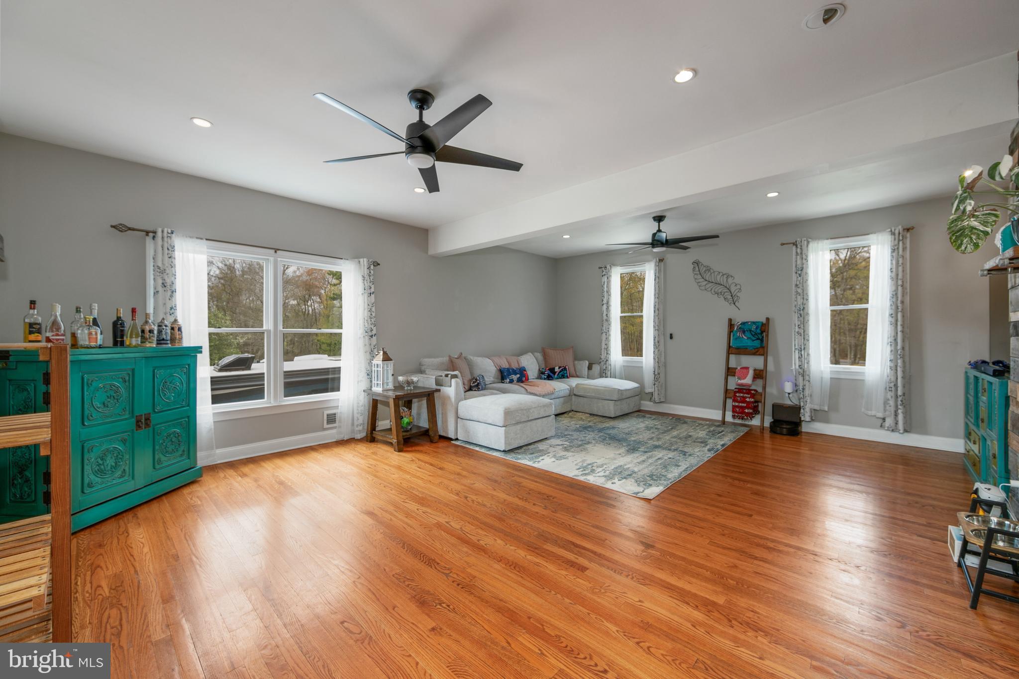 173 West Pleasant Grove Road Jackson, NJ 08527 - Photo 21 of 47 a living room with furniture and a wooden floor