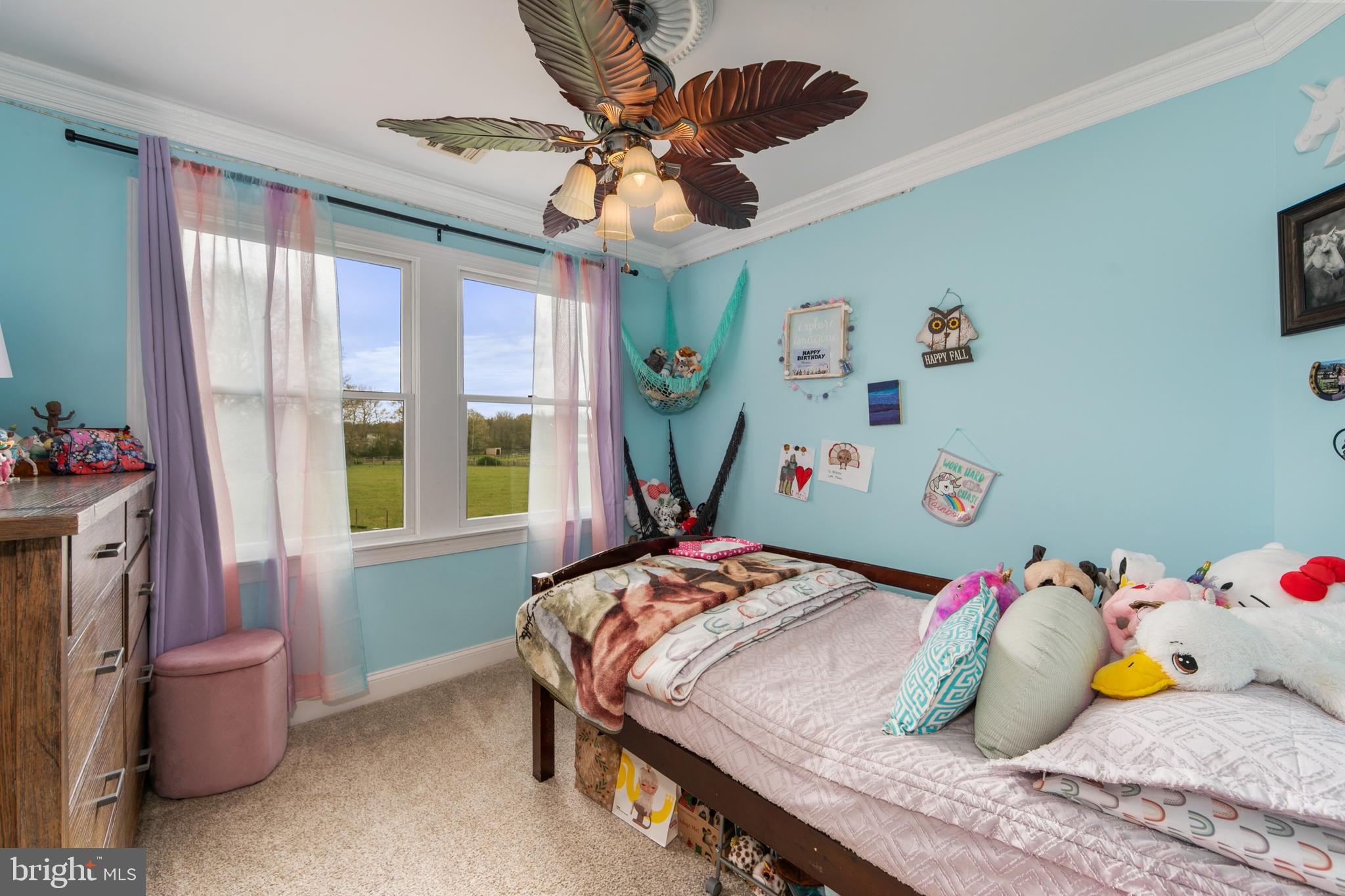 173 West Pleasant Grove Road Jackson, NJ 08527 - Photo 28 of 47 a bedroom with a bed and a chandelier
