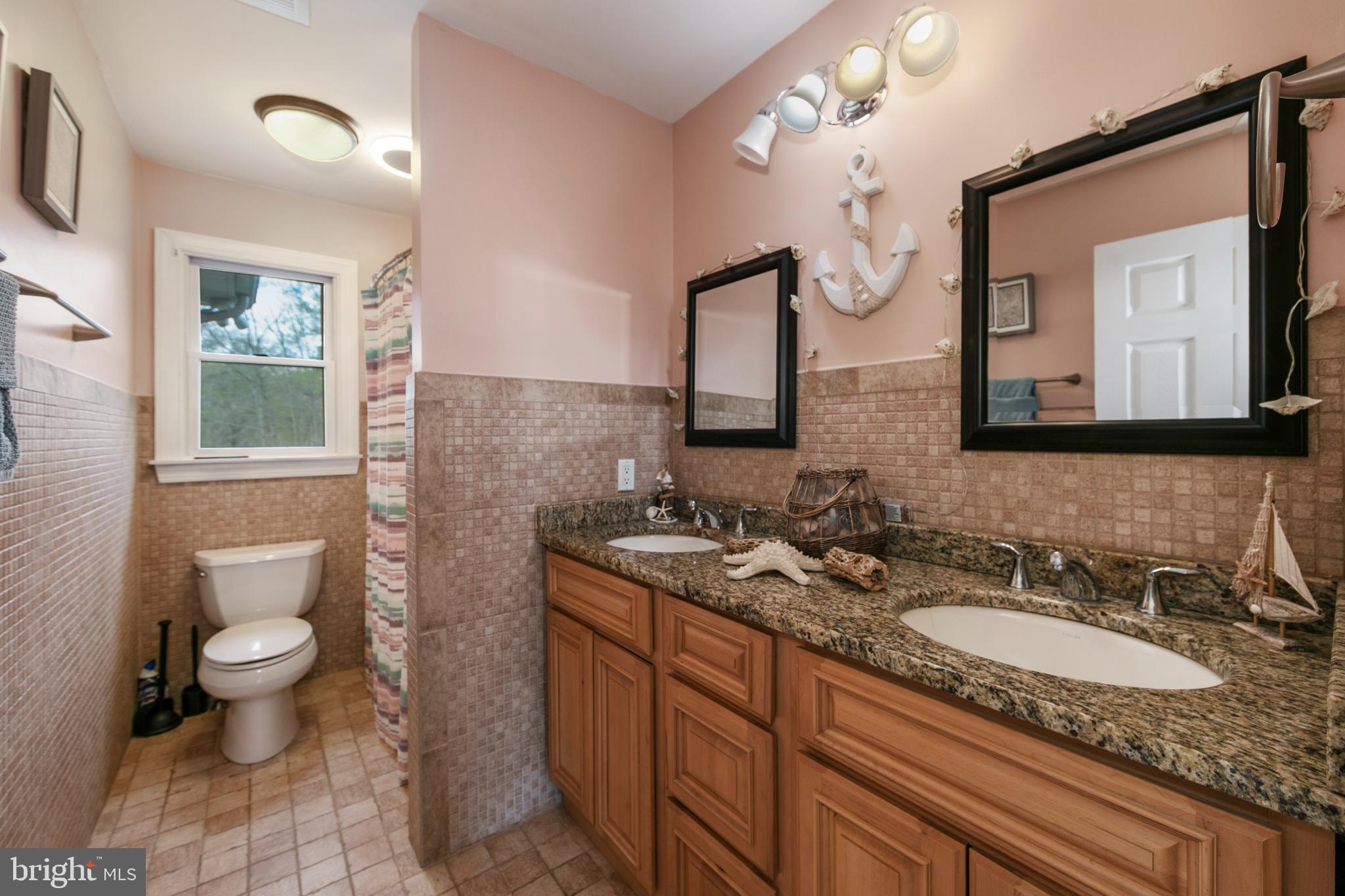 173 West Pleasant Grove Road Jackson, NJ 08527 - Photo 33 of 47 a bathroom with a toilet sink double vanity and mirror