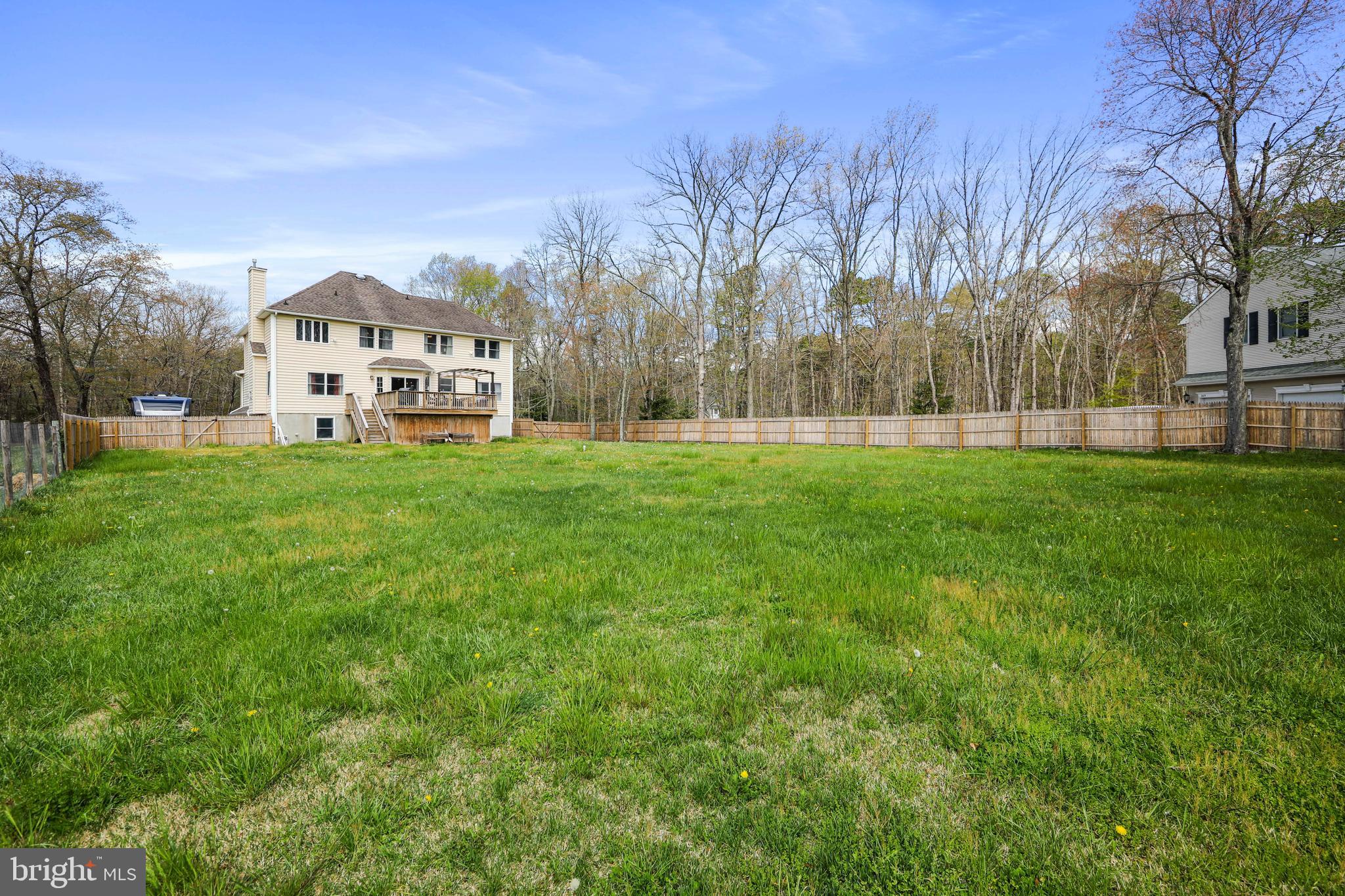 173 West Pleasant Grove Road Jackson, NJ 08527 - Photo 37 of 47 a view of a house with a big yard and large trees