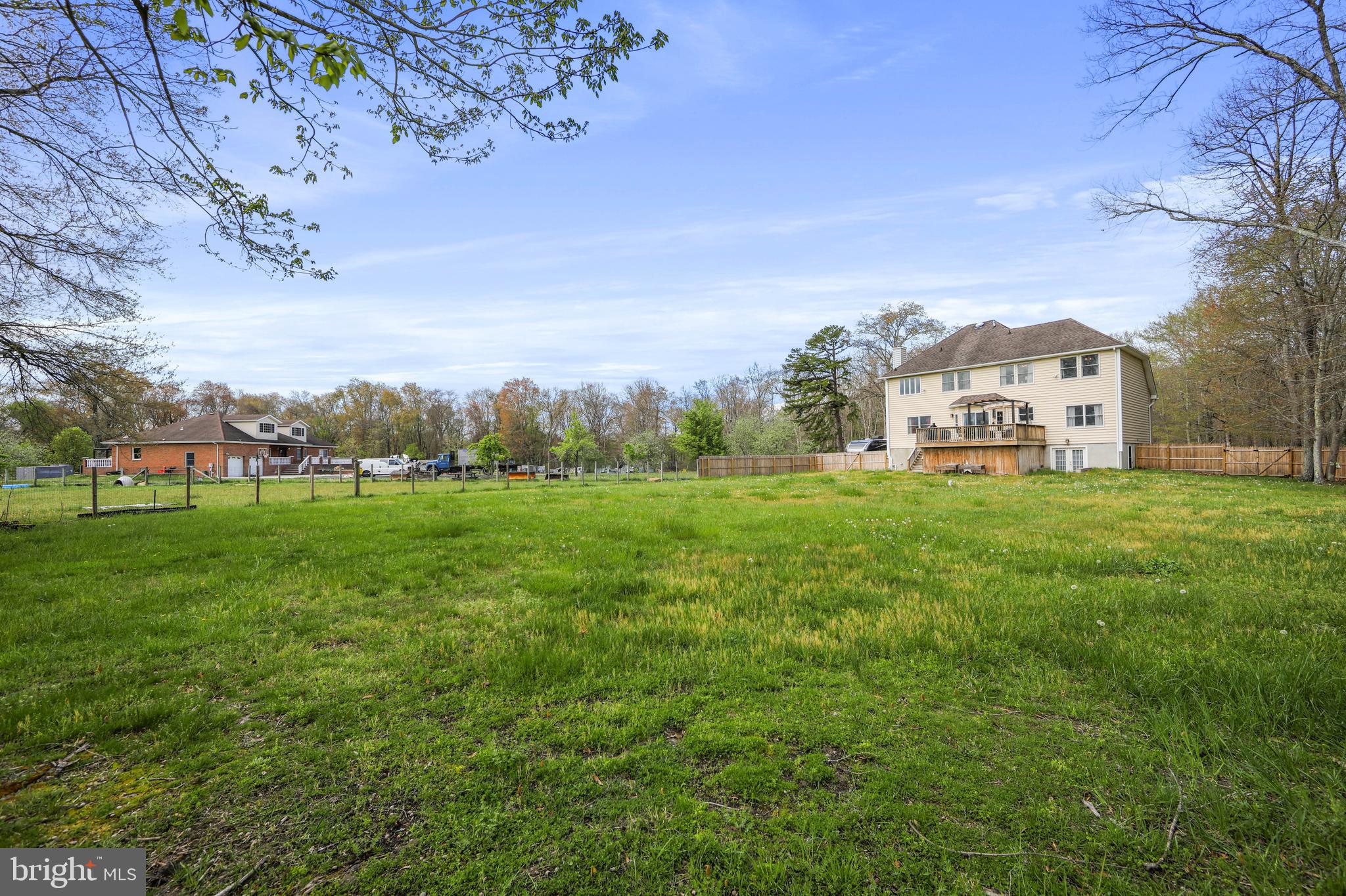 173 West Pleasant Grove Road Jackson, NJ 08527 - Photo 39 of 47 a view of a big house with a big yard and large trees
