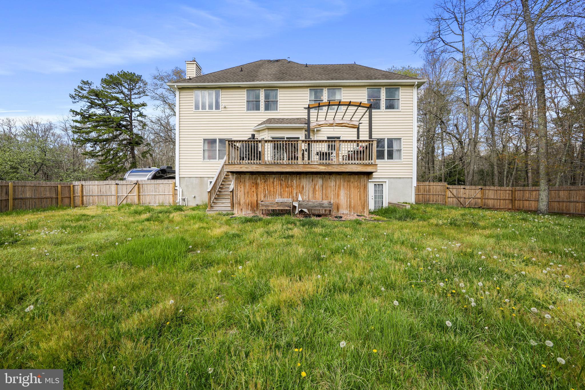 173 West Pleasant Grove Road Jackson, NJ 08527 - Photo 41 of 47 a front view of a house with yard and green space