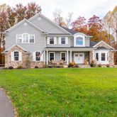 a front view of a house with a garden and porch