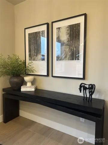 a dining room with furniture window and wooden floor