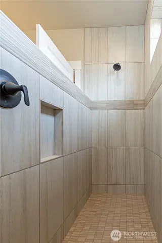 a kitchen with a refrigerator sink and cabinets