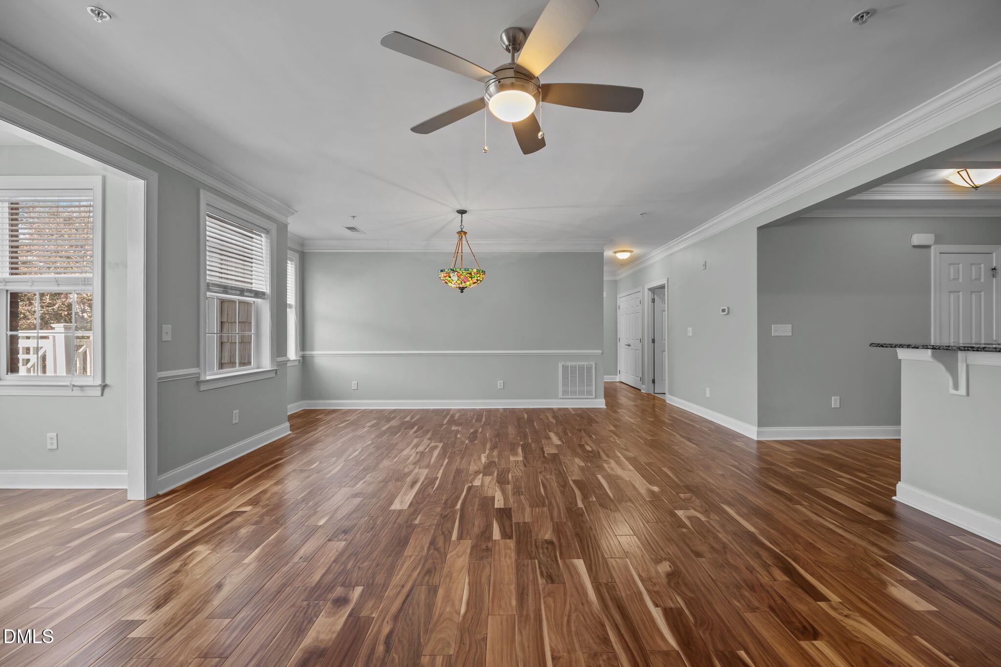10410 Rosegate Court, Unit 201 Raleigh, NC 27617 - Photo 12 of 46 a view of empty room with wooden floor and fan