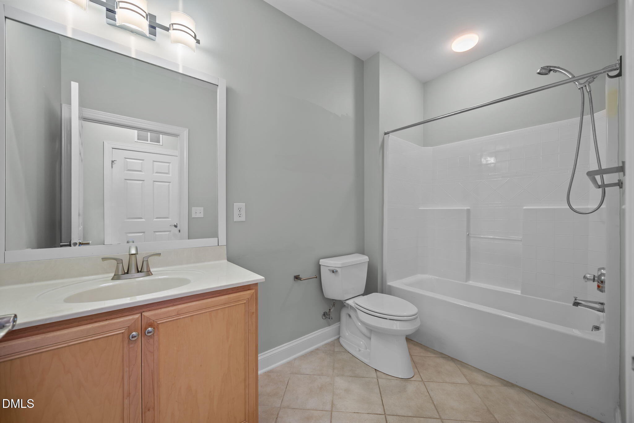 10410 Rosegate Court, Unit 201 Raleigh, NC 27617 - Photo 18 of 46 a bathroom with a sink a toilet and shower