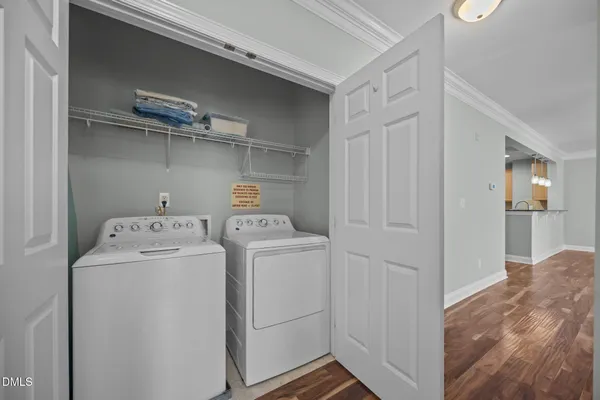 a view of storage and utility room with washer and dryer