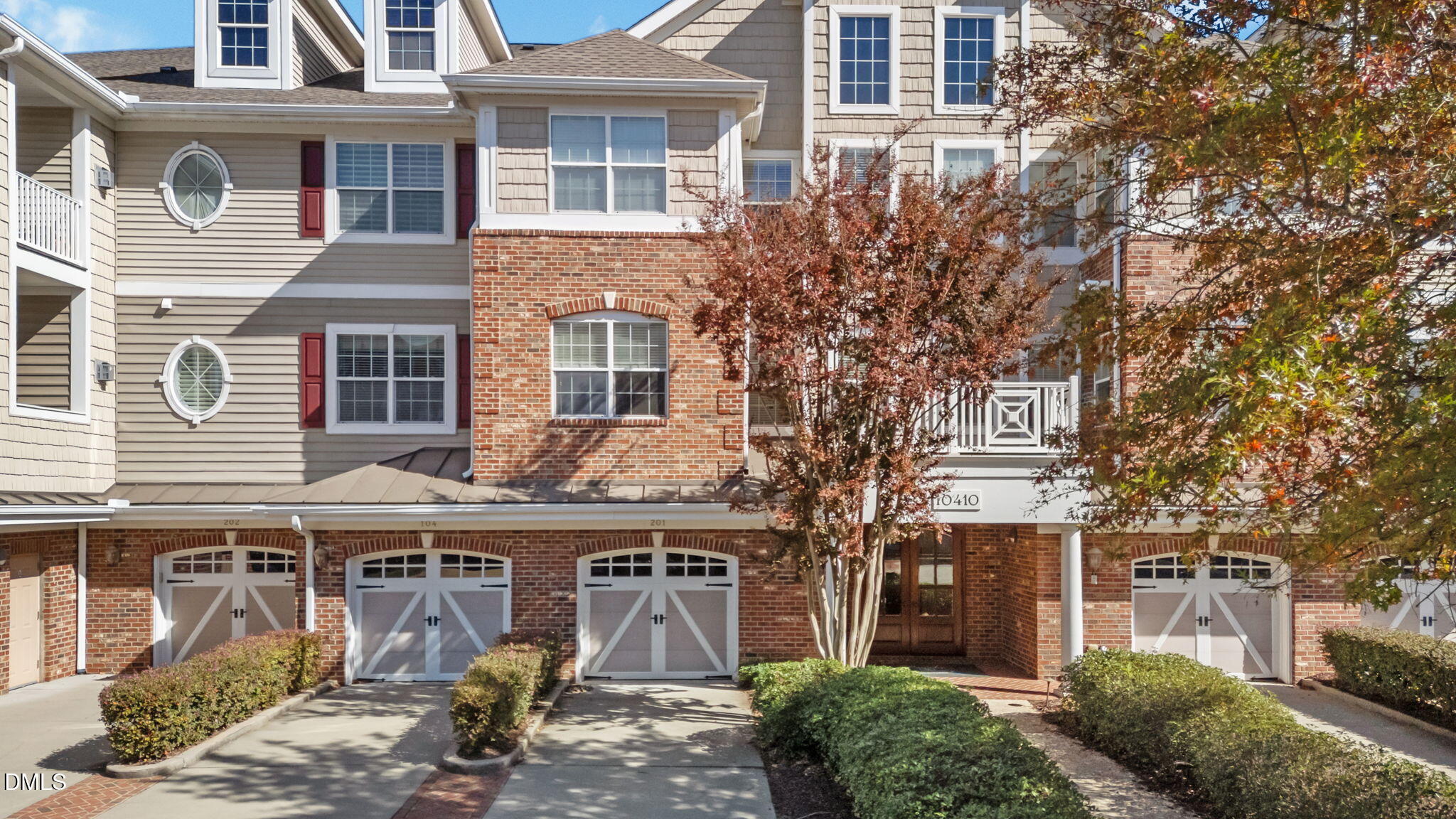 10410 Rosegate Court, Unit 201 Raleigh, NC 27617 - Photo 2 of 46 a front view of a building with large windows