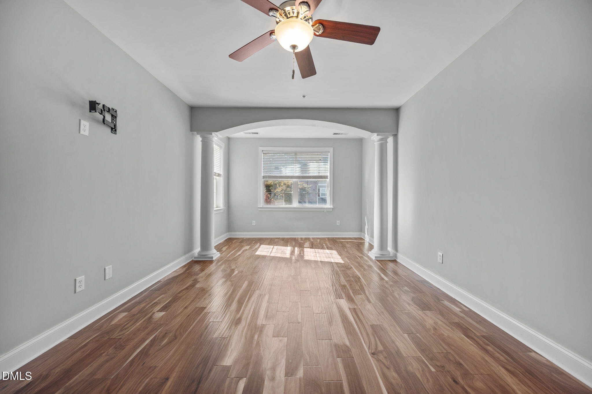 10410 Rosegate Court, Unit 201 Raleigh, NC 27617 - Photo 23 of 46 wooden floor in an empty room with a window