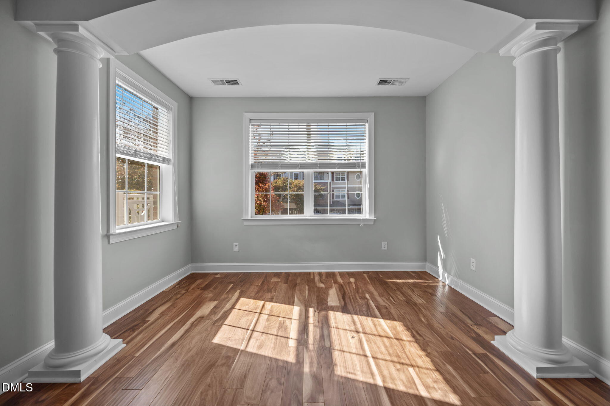 10410 Rosegate Court, Unit 201 Raleigh, NC 27617 - Photo 25 of 46 a view of an empty room with wooden floor and a window