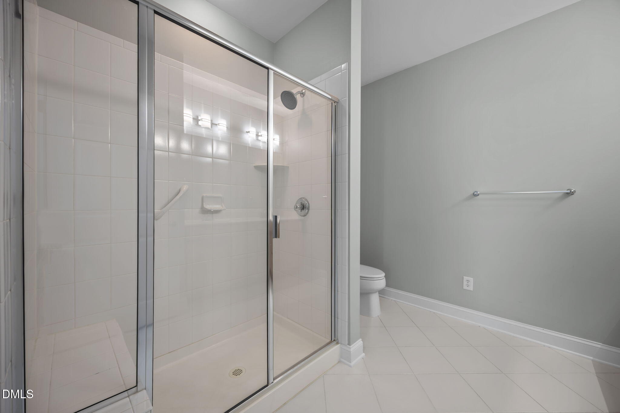 10410 Rosegate Court, Unit 201 Raleigh, NC 27617 - Photo 28 of 46 a bathroom with a glass shower door