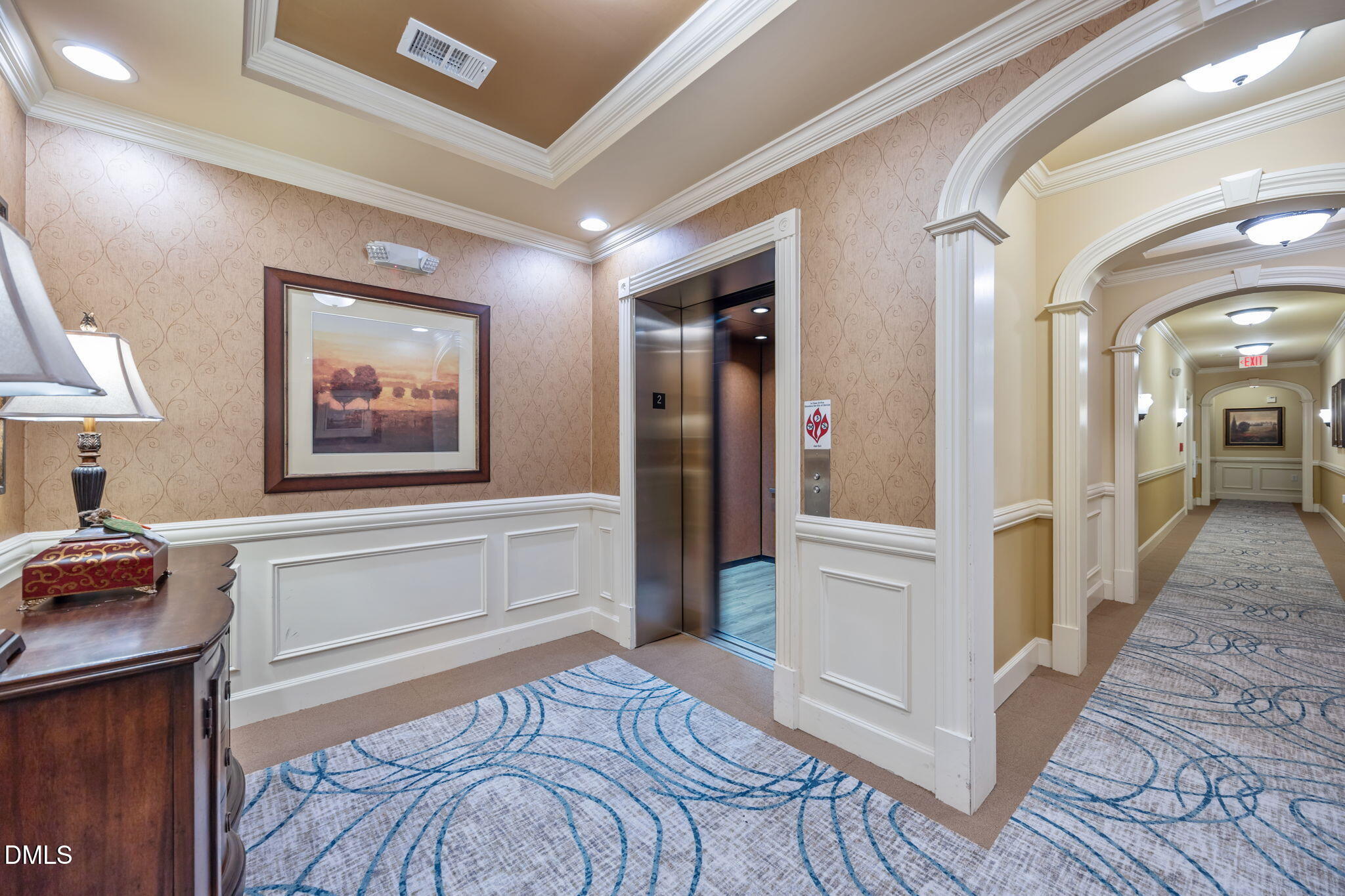 10410 Rosegate Court, Unit 201 Raleigh, NC 27617 - Photo 31 of 46 a view of a hallway with wooden floor and cabinet