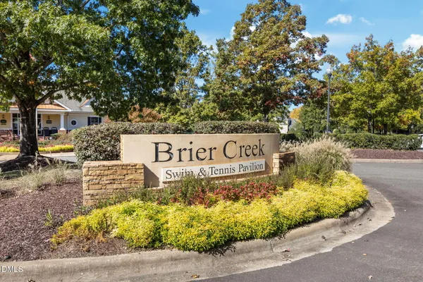 a view of outdoor space with signage and flags