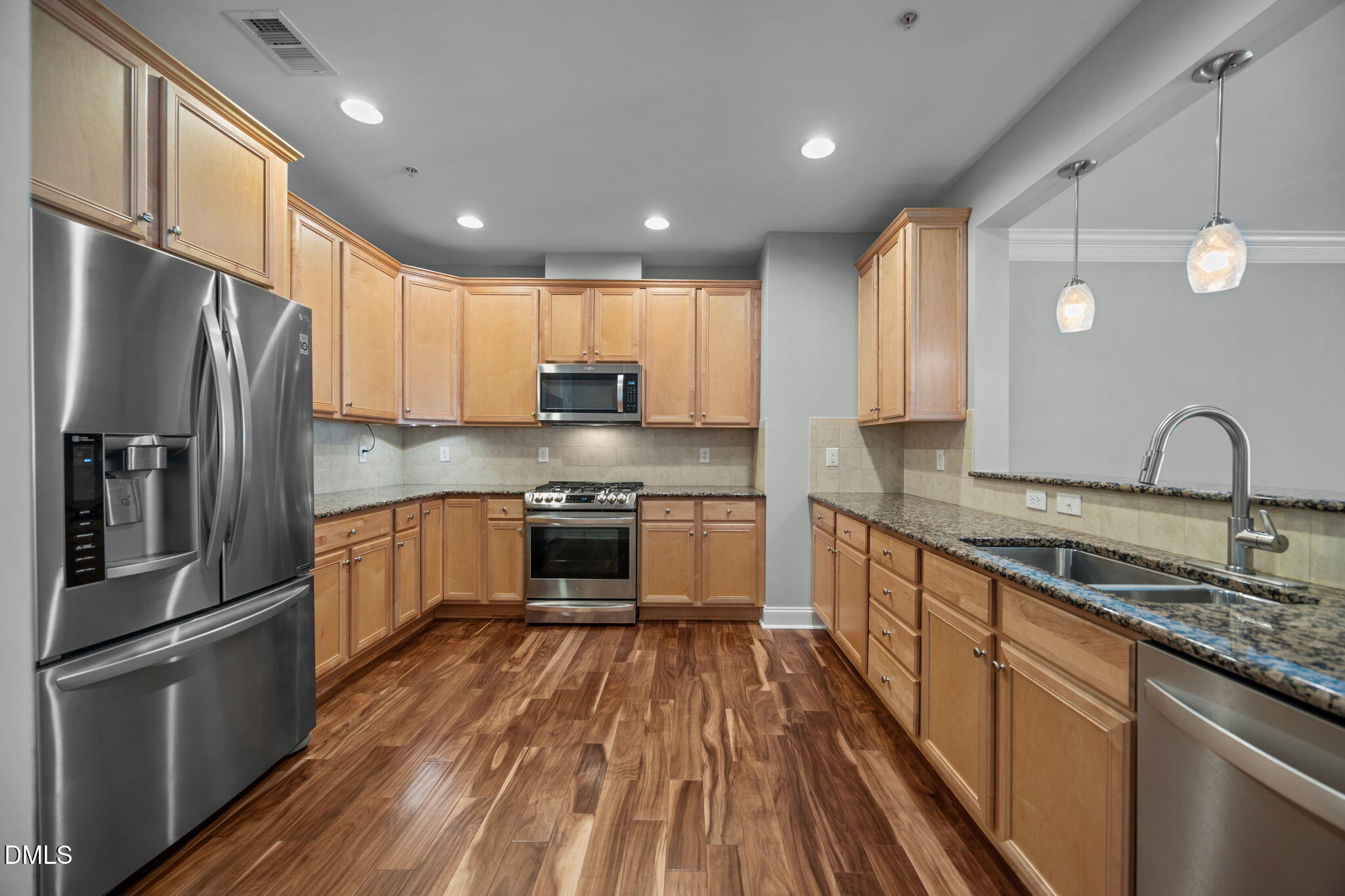 10410 Rosegate Court, Unit 201 Raleigh, NC 27617 - Photo 6 of 46 a kitchen with stainless steel appliances granite countertop a sink refrigerator and cabinets