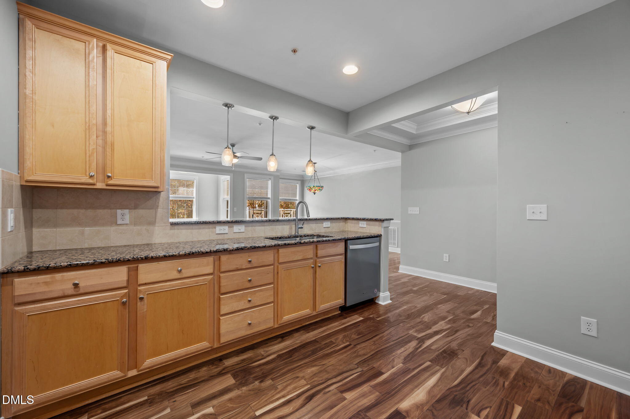 10410 Rosegate Court, Unit 201 Raleigh, NC 27617 - Photo 8 of 46 a kitchen with granite countertop white cabinets and white appliances