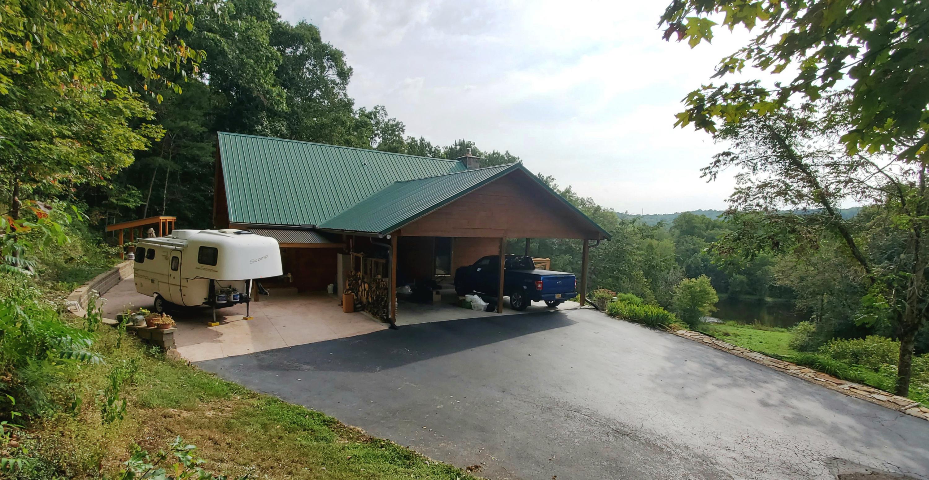 180 Windsong Road Clinton, TN 37716 - Photo 26 of 33 CarportViewPond