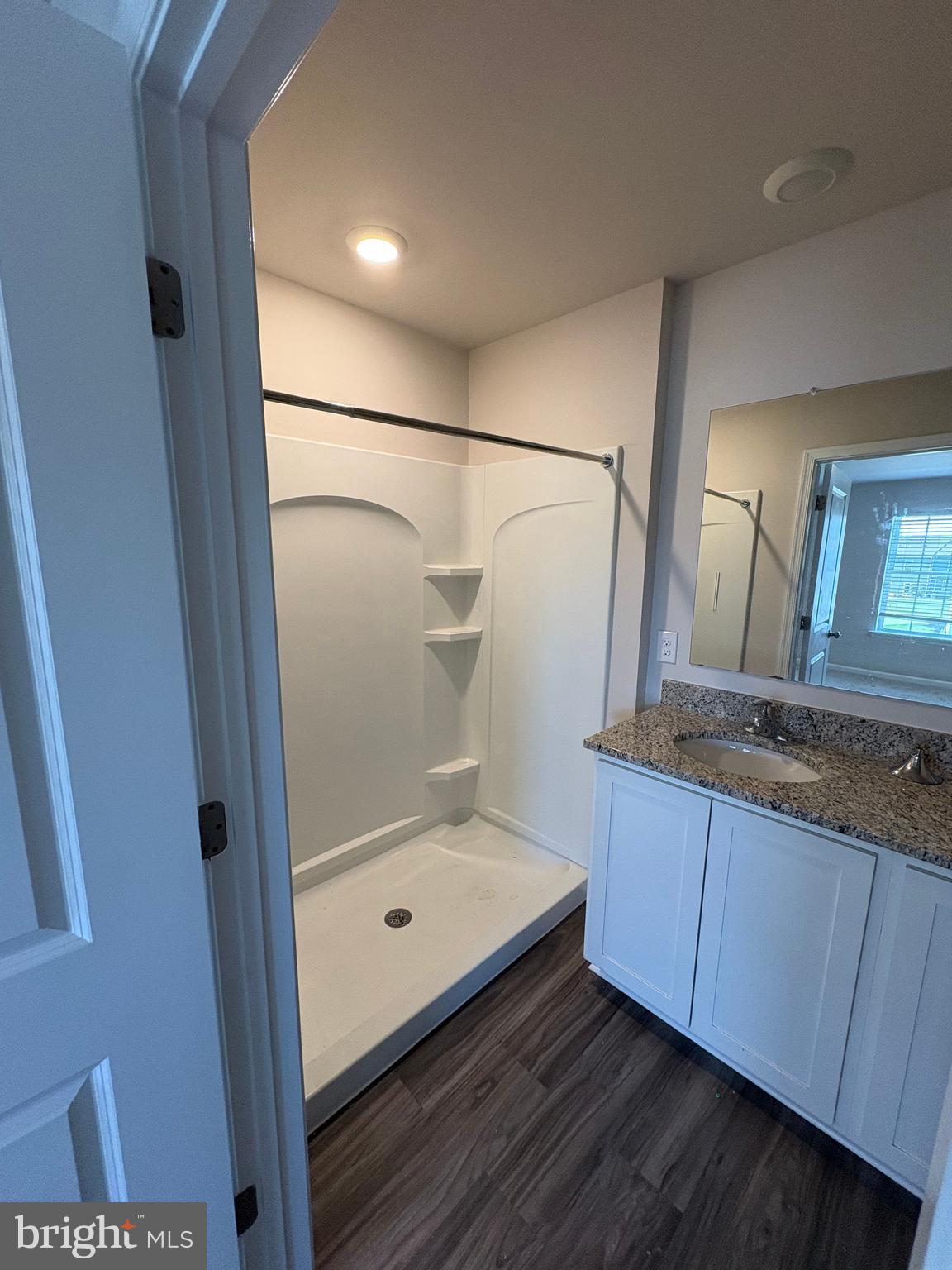 410 Maple Run Drive York, PA 17404 - Photo 17 of 19 a bathroom with a granite countertop sink a mirror and shower