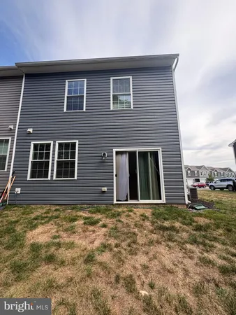 a house that has a large window in front of it