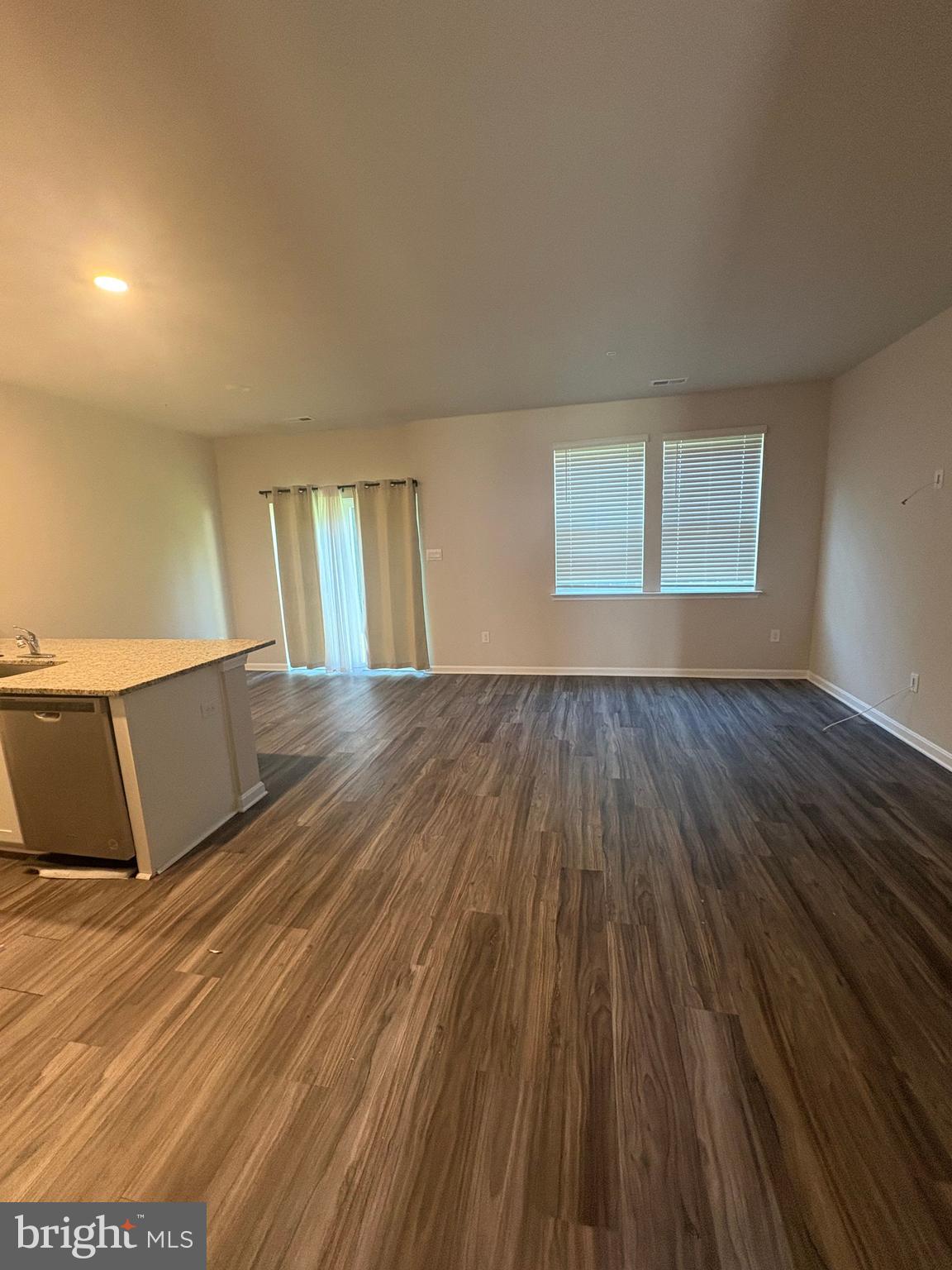 410 Maple Run Drive York, PA 17404 - Photo 8 of 19 a view of an empty room with wooden floor and a window