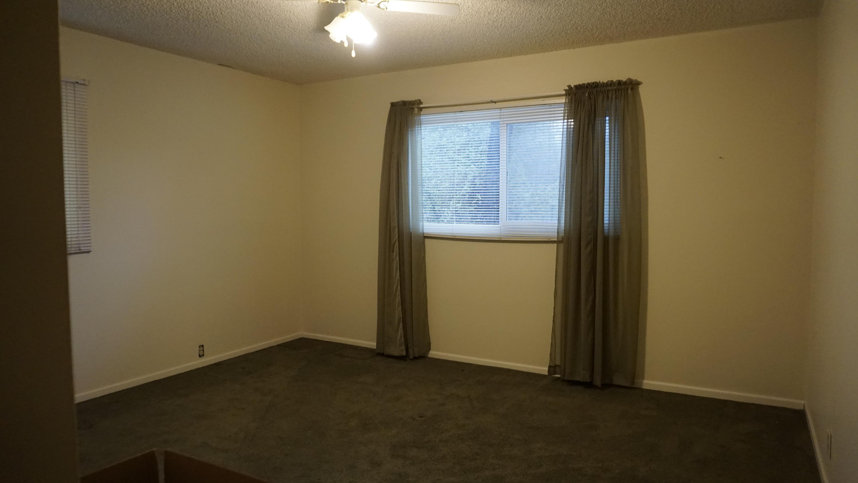 3083 Keswick Dam Road Redding, CA 96003 - Photo 14 of 19 an empty room with windows and closet