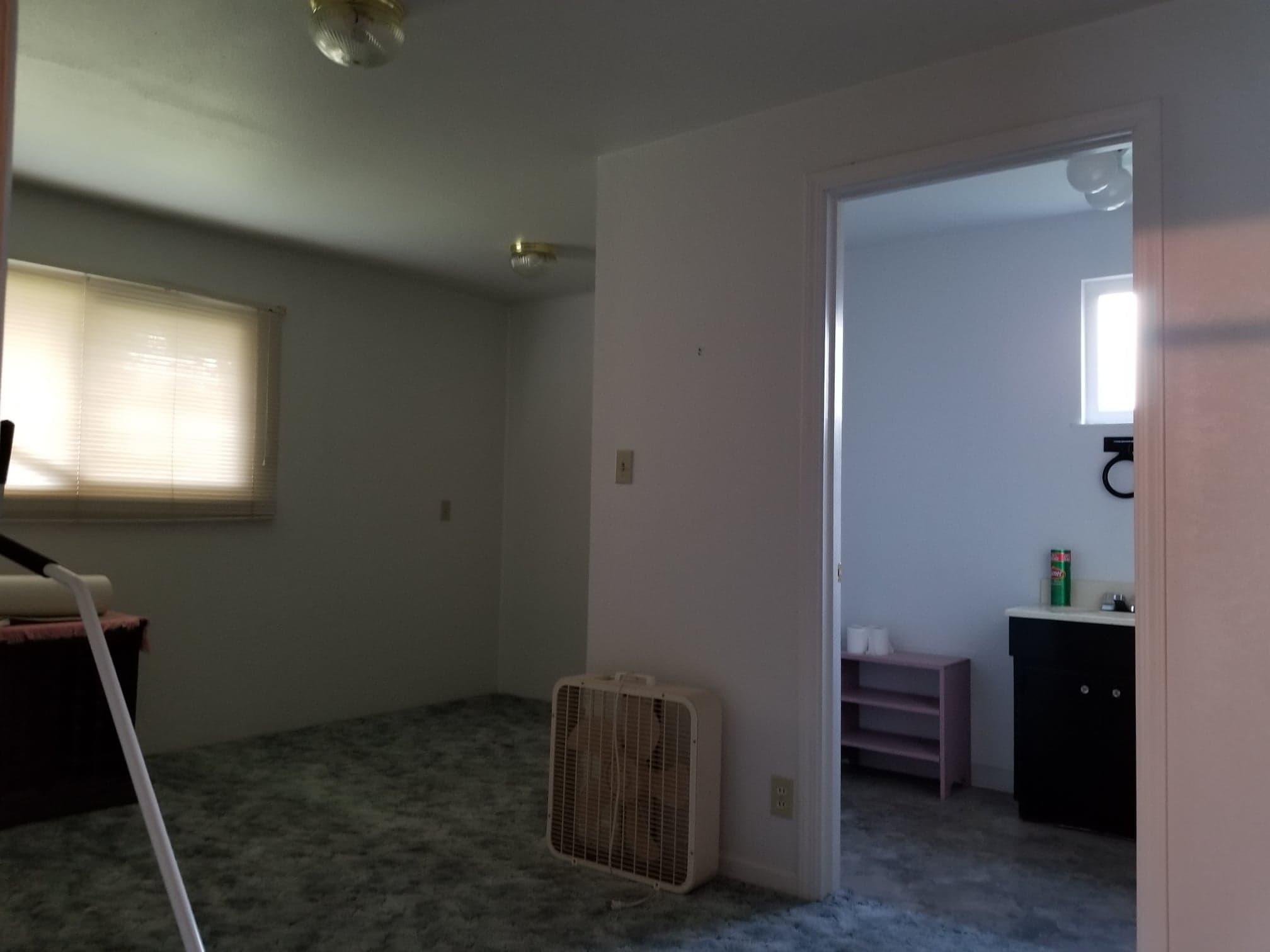 3083 Keswick Dam Road Redding, CA 96003 - Photo 18 of 19 a room with a chair and a mirror