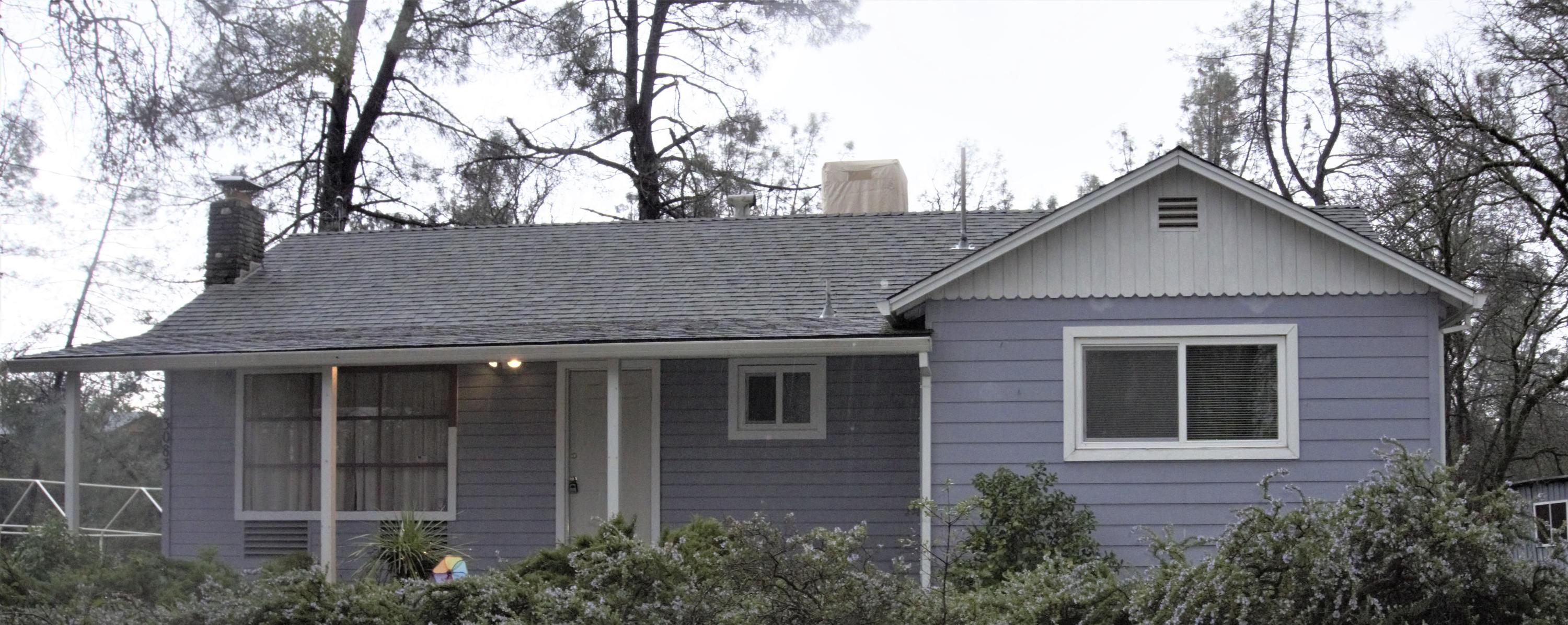 3083 Keswick Dam Road Redding, CA 96003 - Photo 19 of 19 a front view of a house with yard and trees