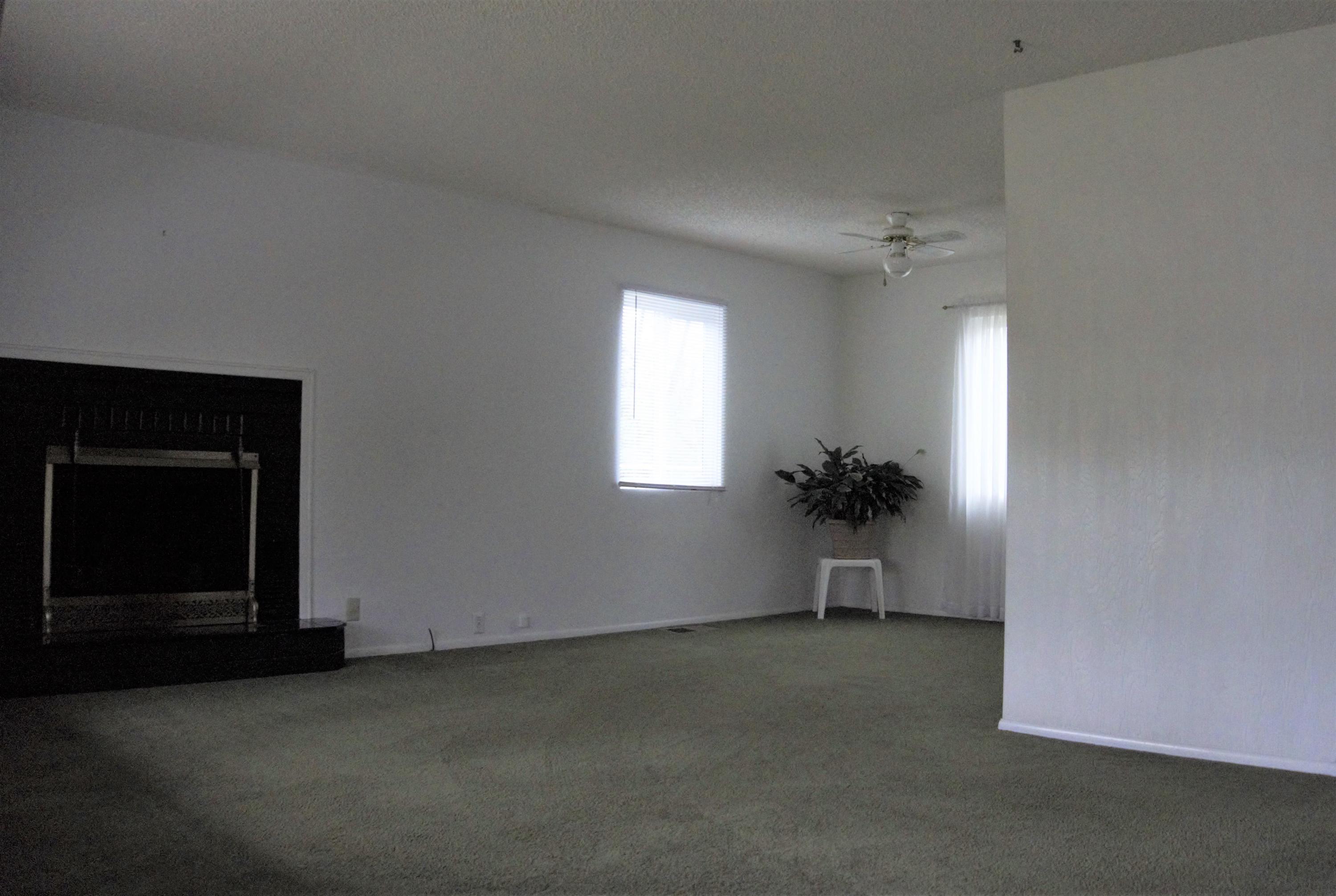 3083 Keswick Dam Road Redding, CA 96003 - Photo 8 of 19 a view of empty room with a fireplace