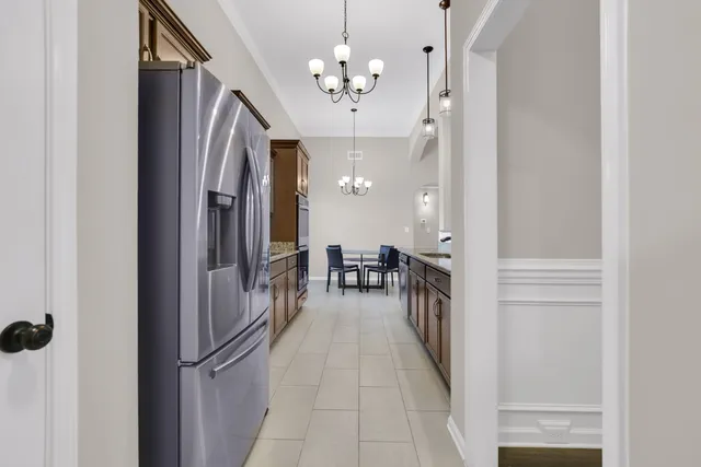 a view of a kitchen from the hallway
