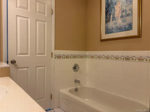 a bathroom with bathtub and shower