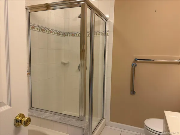 a bathroom with a shower and a toilet