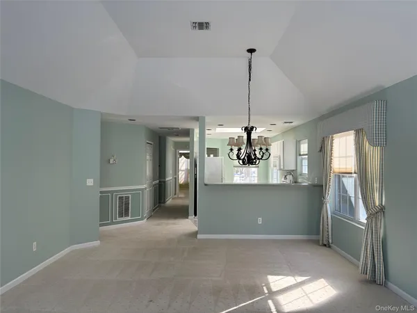 a view of a room with a chandelier