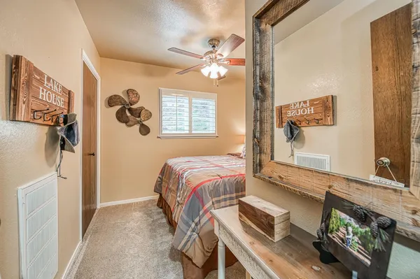 a bathroom with a sink a mirror and a window