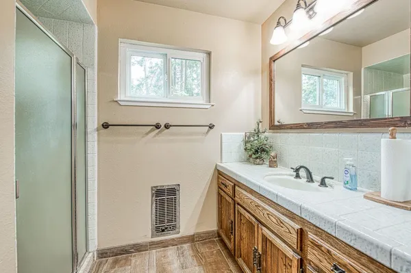 a view of a hallway with paintings on the wall