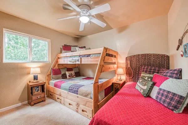 a bedroom with a bed and window