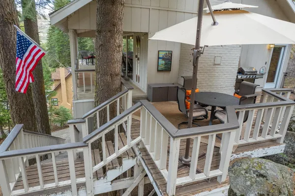 a balcony view with a lot of stuff and furniture