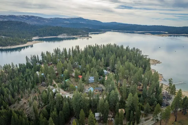 an aerial view of residential house with outdoor space and river
