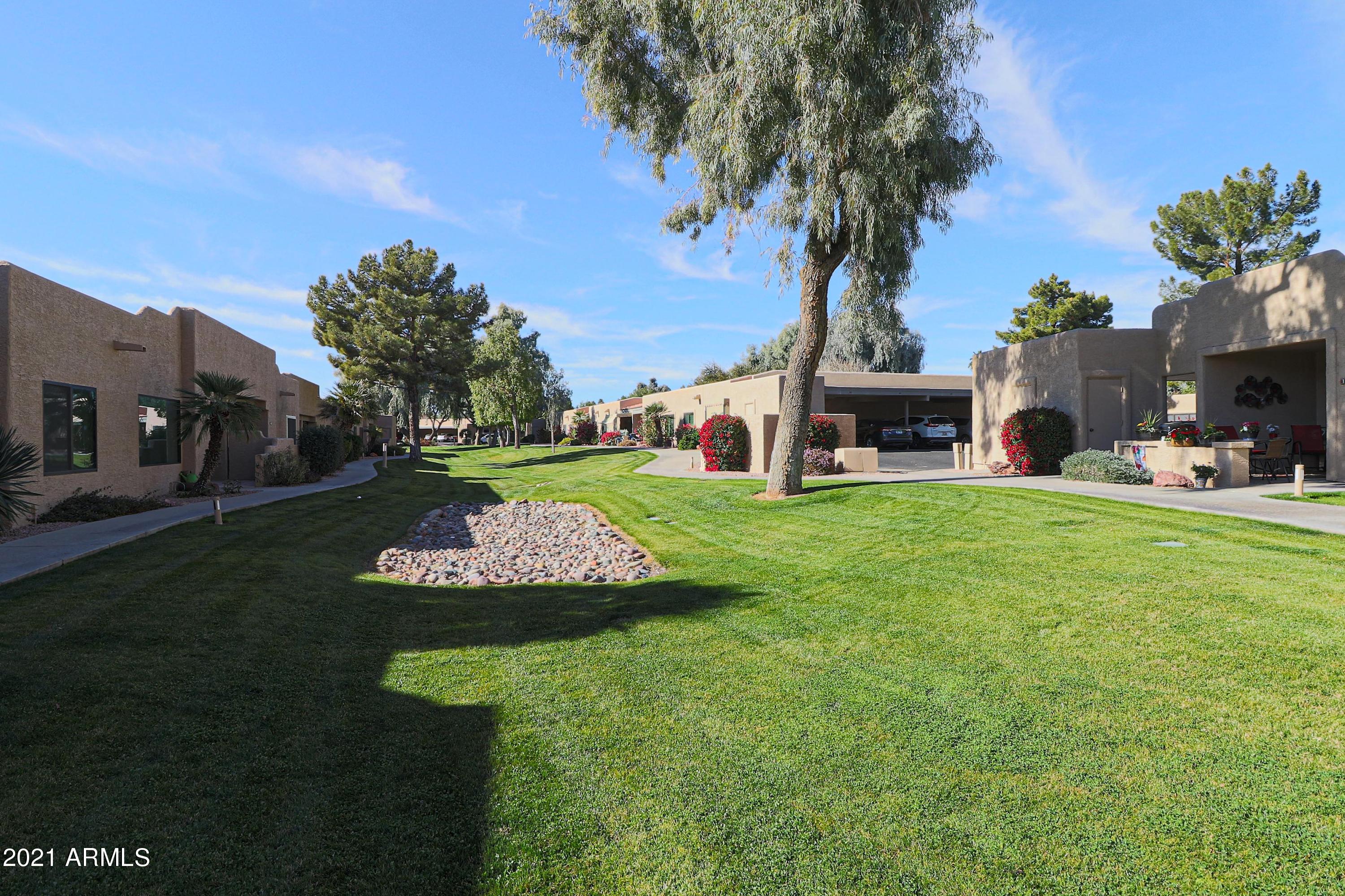 14300 West Bell Road, Unit 131 Surprise, AZ 85374 - Photo 3 of 20 Grassy Area in Front of Condo