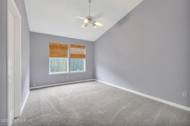 a bathroom with a sink a light fixture and a mirror