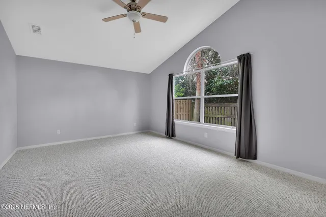 a bathroom with a bathtub sink and mirror
