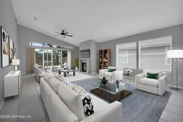 a kitchen with granite countertop a refrigerator and a sink