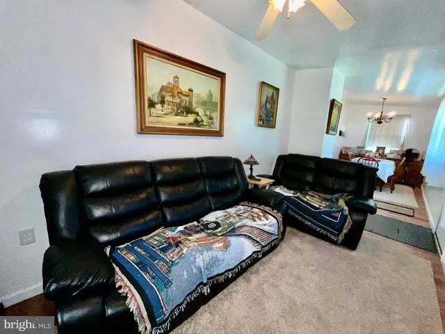 a living room with furniture and a couch