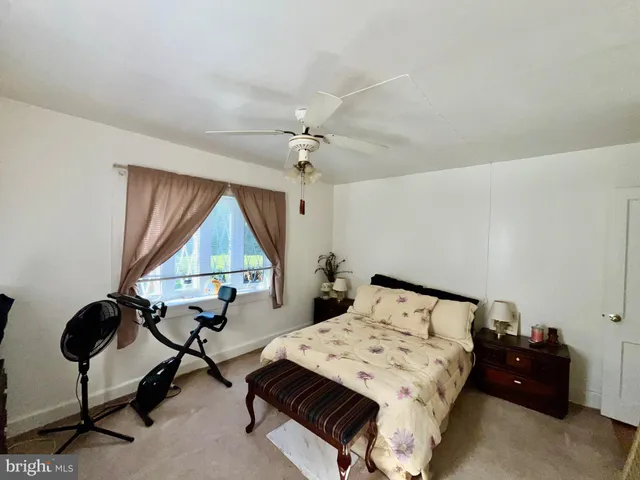 a bedroom with furniture and a window