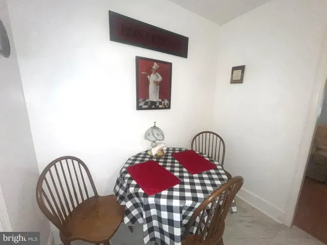 a view of hall way with furniture