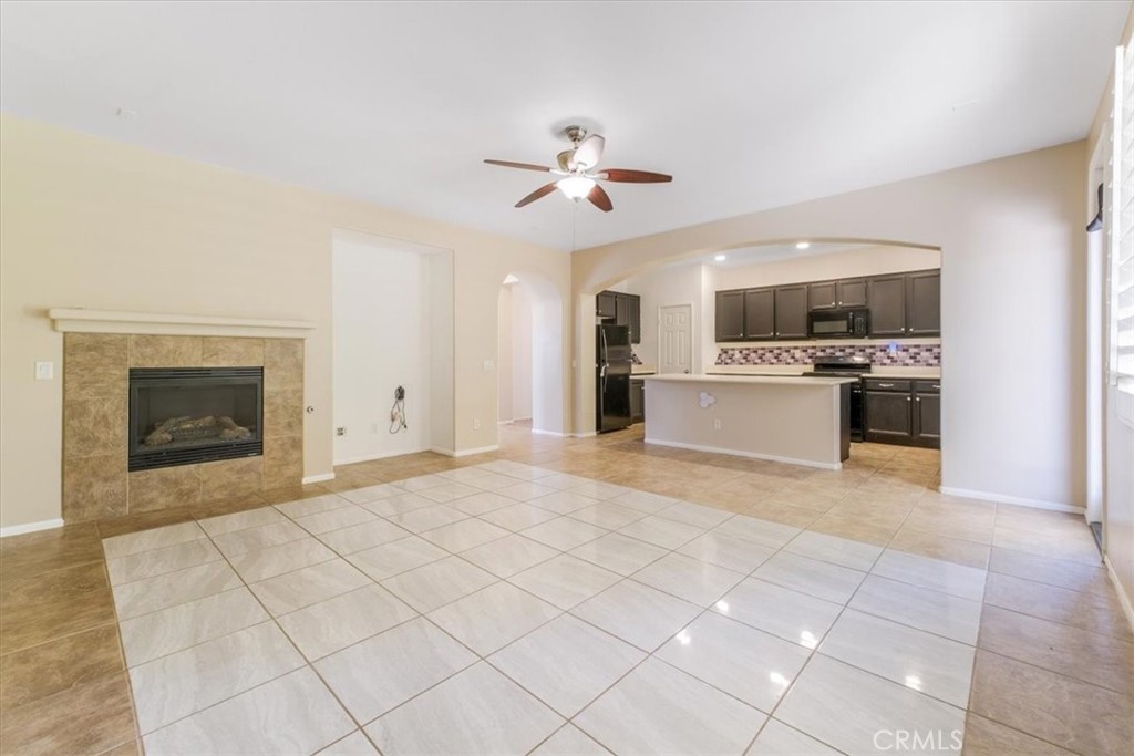 40530 Amador Drive Indio, CA 92203 - Photo 19 of 59 a view of a kitchen with a stove cabinets and a fireplace