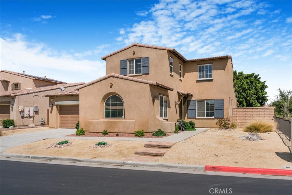 40530 Amador Drive Indio, CA 92203 - Photo 2 of 59 a view of a white house with a snow on the side of it