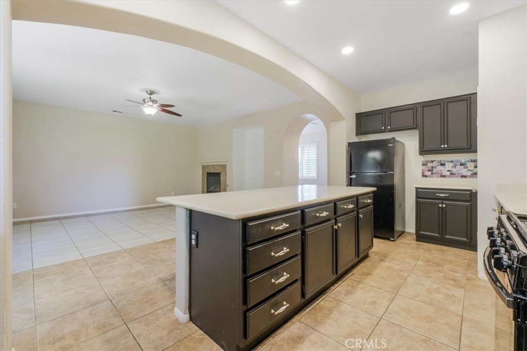 40530 Amador Drive Indio, CA 92203 - Photo 23 of 59 a kitchen with a cabinets and a stove top oven